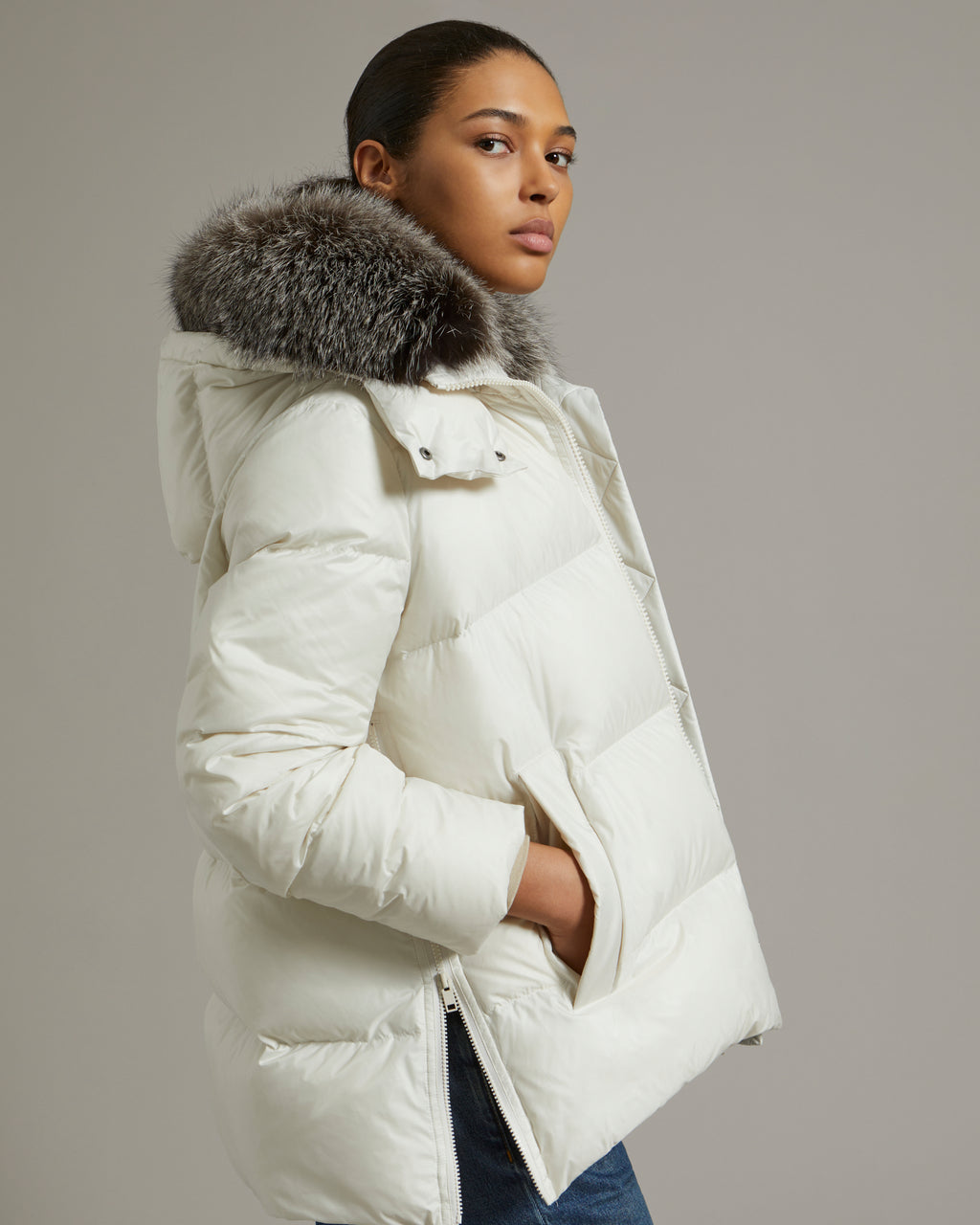 A line down jacket in water-repellent technical fabric with fox fur collar