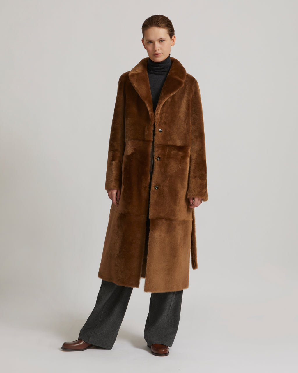 Long reversible belted shearling coat