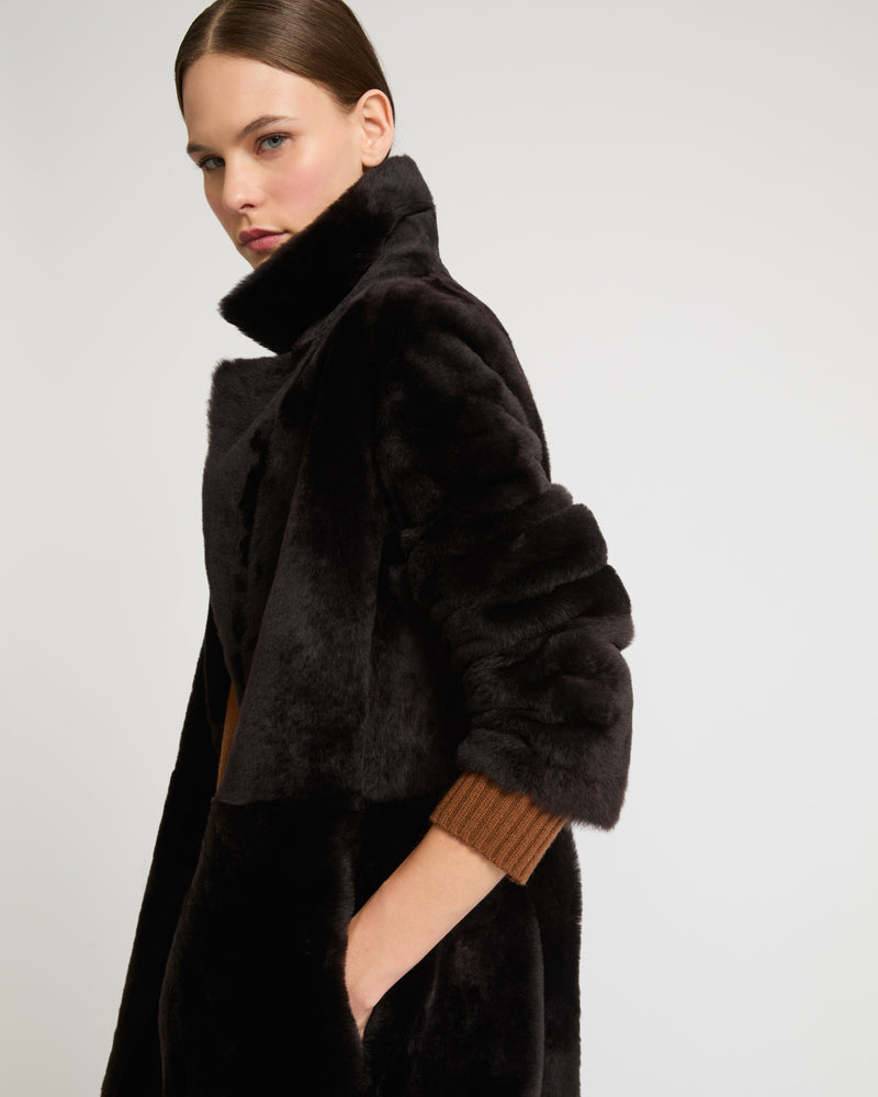 Long reversible belted shearling coat