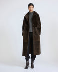 Reversible belted long shearling coat