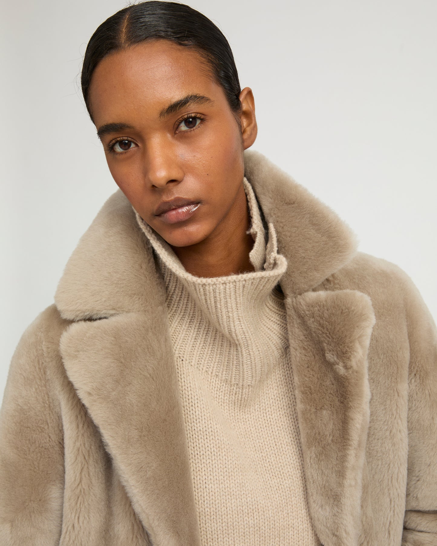 Long reversible belted shearling coat
