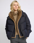 Iconic "A" line down jacket with mink fur hooded bib