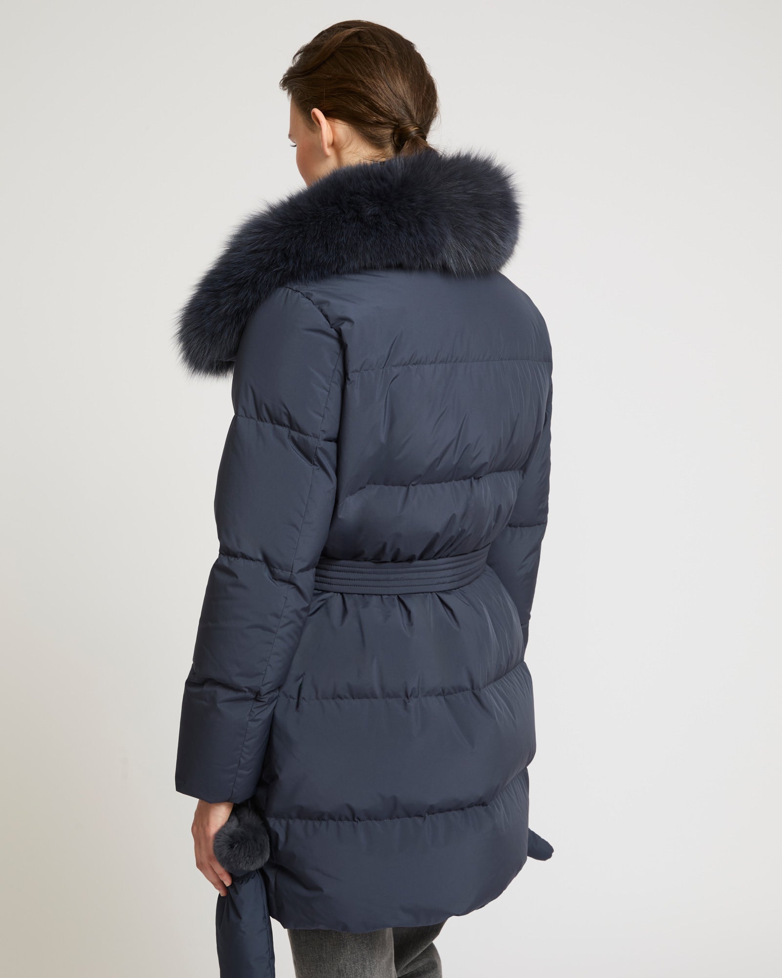 Belted down jacket in waterproof technical fabric with fox
