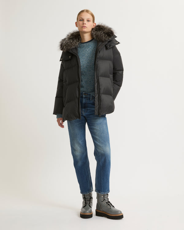 A line down jacket in water-repellent technical fabric with fox fur collar