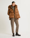 A line down jacket in water-repellent technical fabric with fluffy lambswool collar