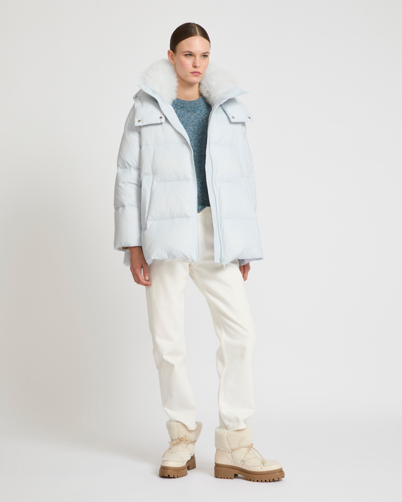 A line down jacket in water-repellent technical fabric with fluffy  lambswool collar