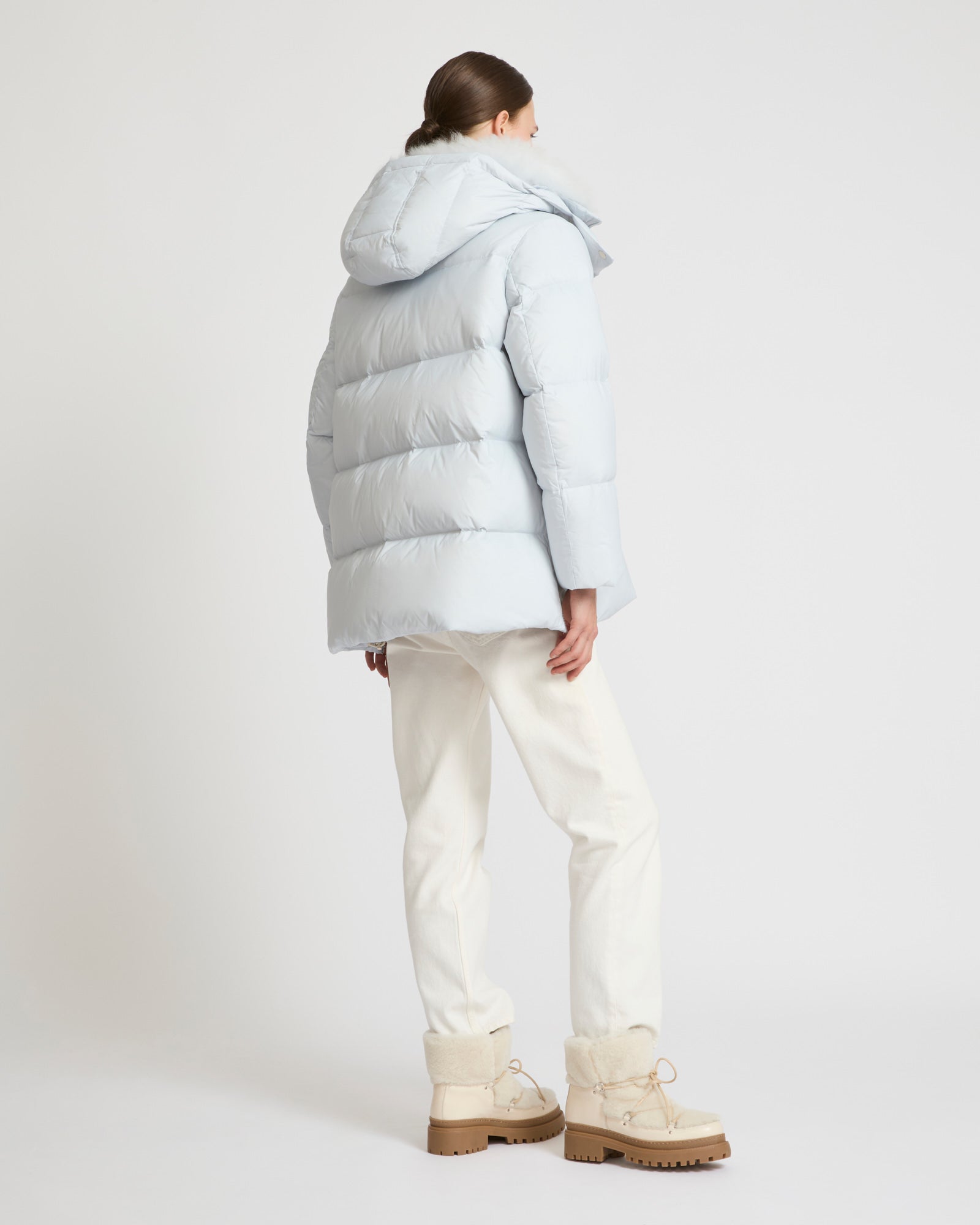 A line down jacket in water-repellent technical fabric with fluffy  lambswool collar