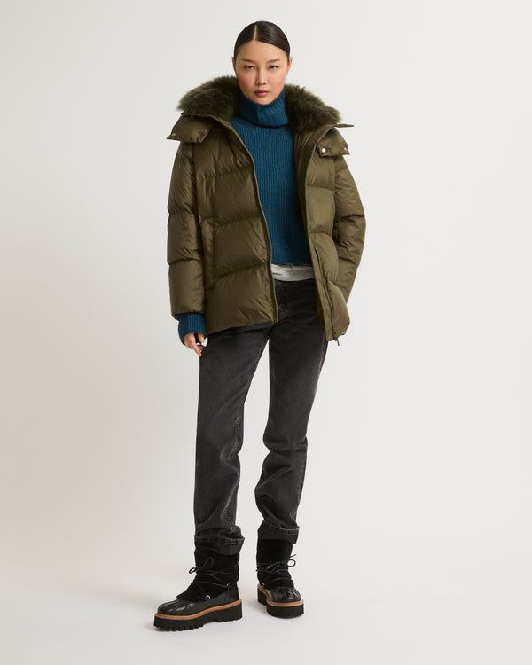 A line down jacket in water-repellent technical fabric with fluffy lambswool collar