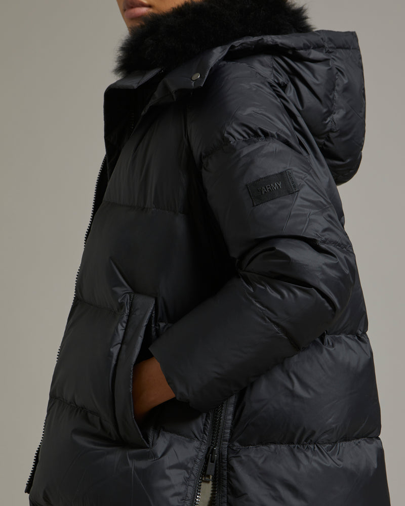 A line down jacket in water-repellent technical fabric with fluffy ...