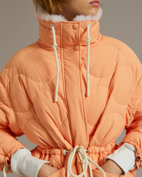 Down-filled coat in water-repellent technical fabric with short-haired lambskin collar trim
