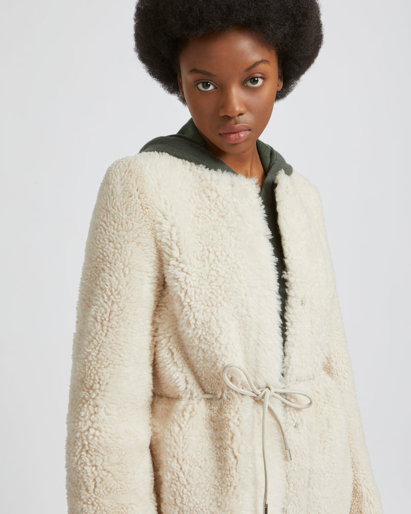 Cream collarless cheap coat