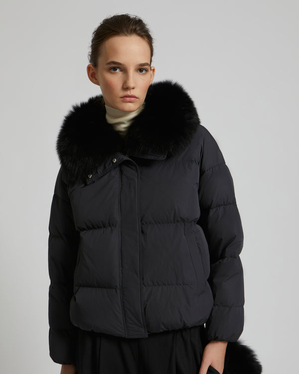 Boxy down jacket in waterproof technical fabric with fox fur collar