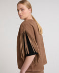 Short fringed cape in double-sided velour lamb leather