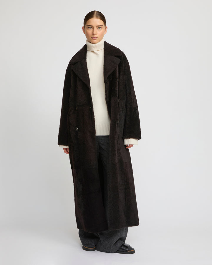 Double-breasted astrakan-style lambskin shearling coat