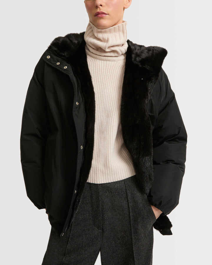 Hooded down jacket in technical fabric and mink fur
