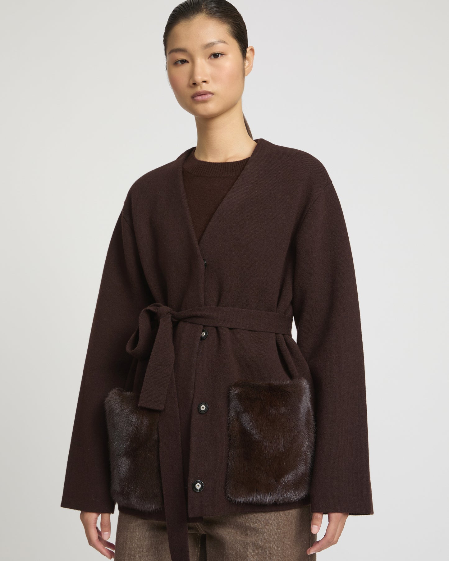 Belted knit and mink jacket