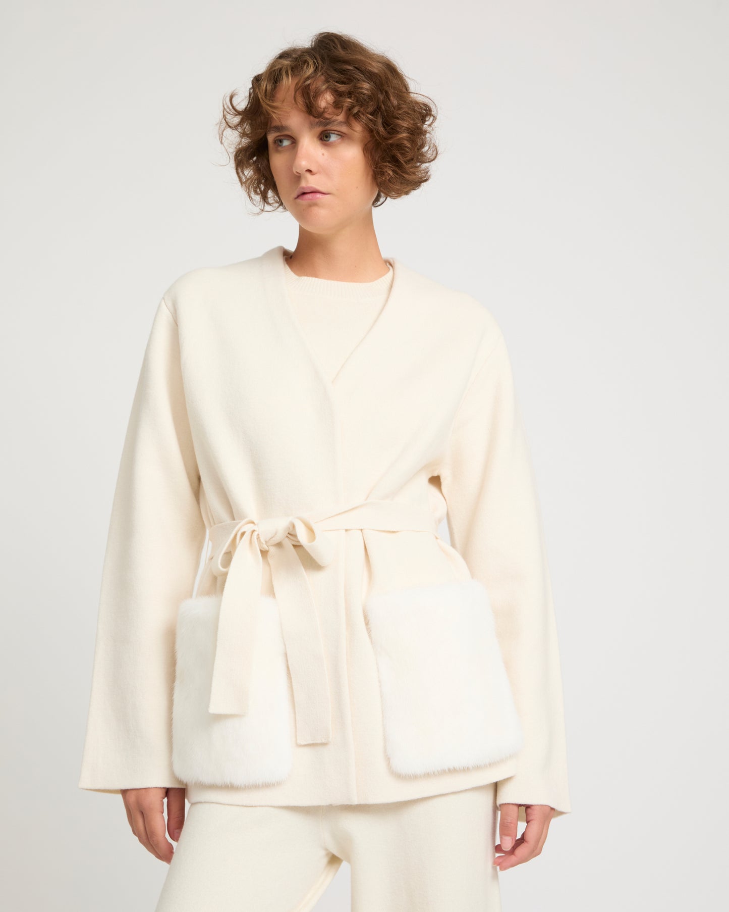 Belted knit and mink jacket