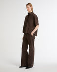 Loose fit poplin trousers with leather details