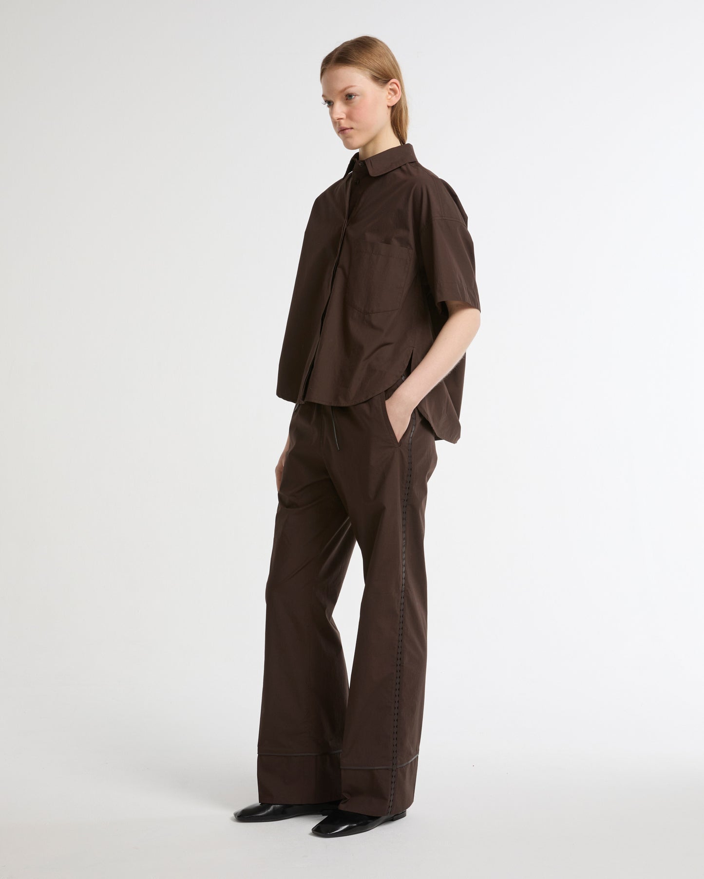 Loose fit poplin trousers with leather details