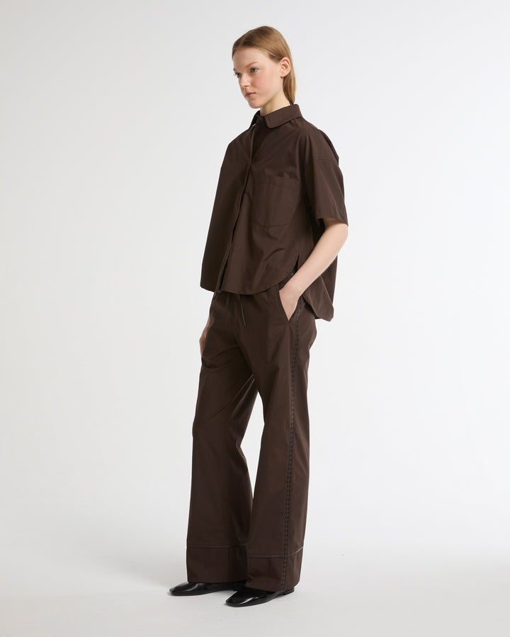 Loose fit poplin trousers with leather details