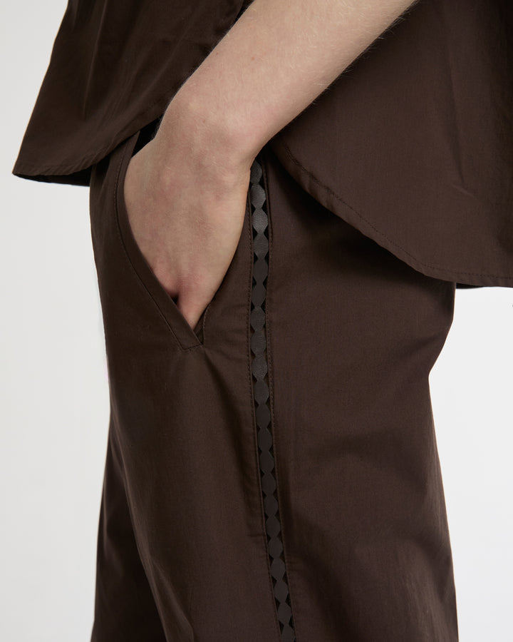 Loose fit poplin trousers with leather details