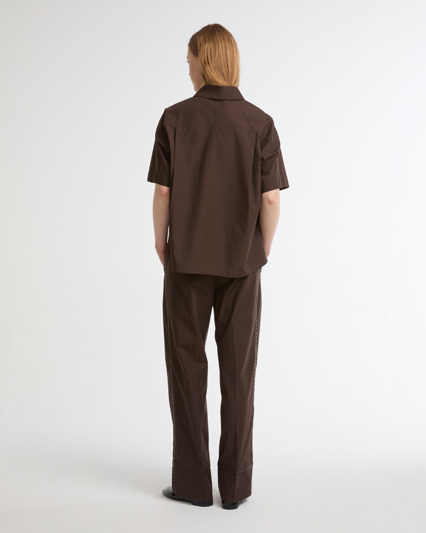 Loose fit poplin trousers with leather details