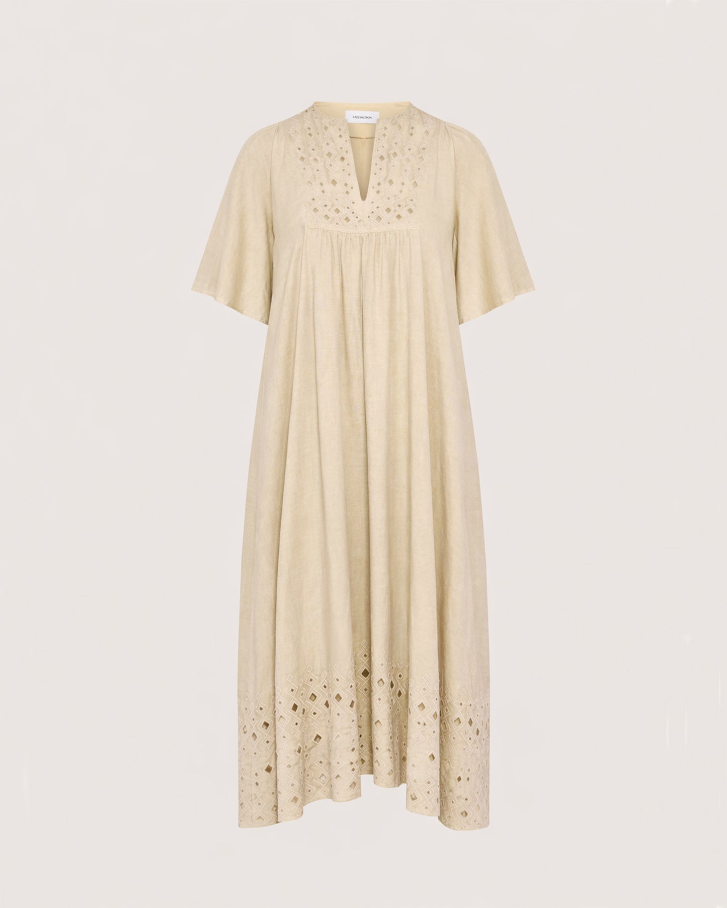 Flowing dress in embroidered linen