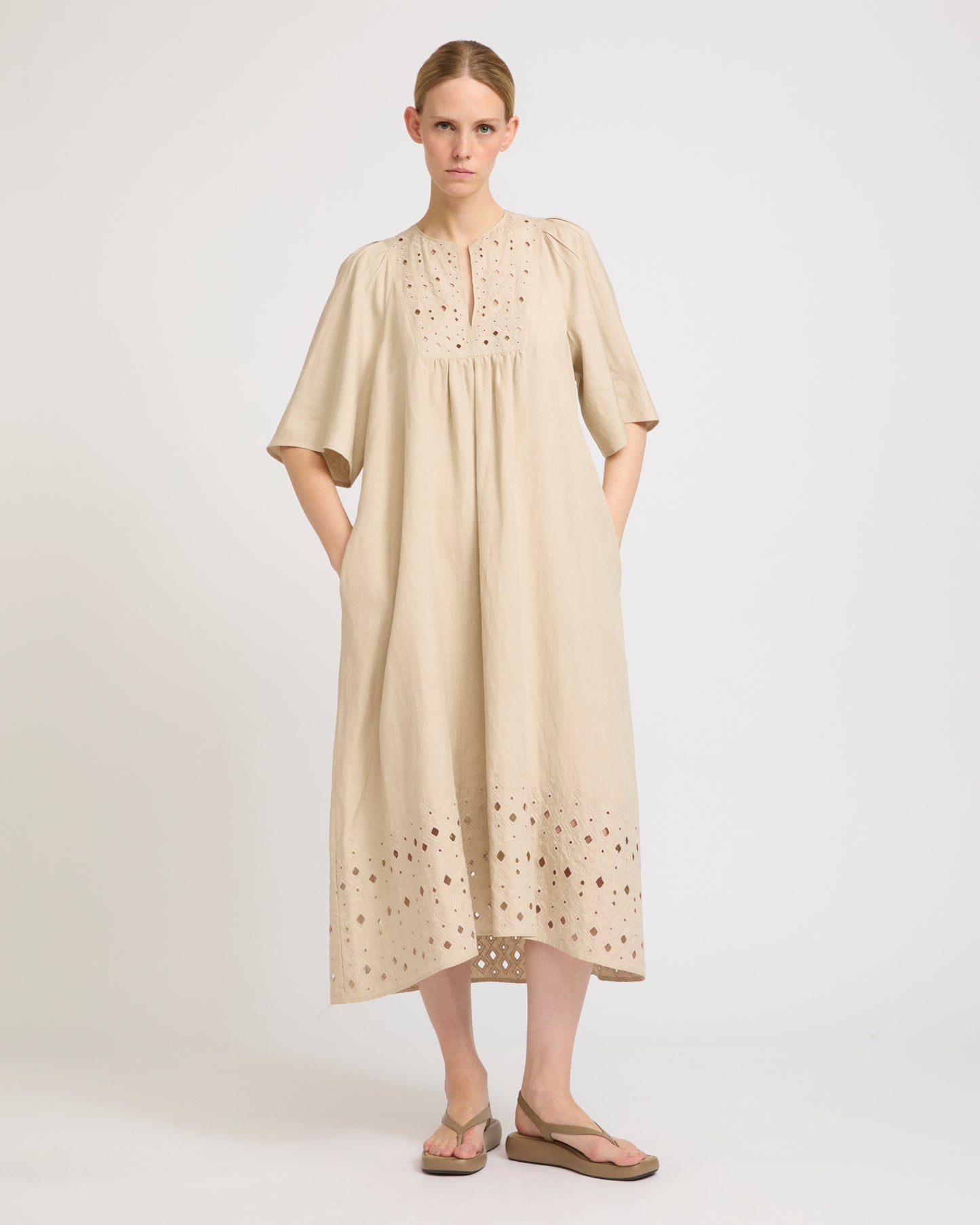 Flowing dress in embroidered linen