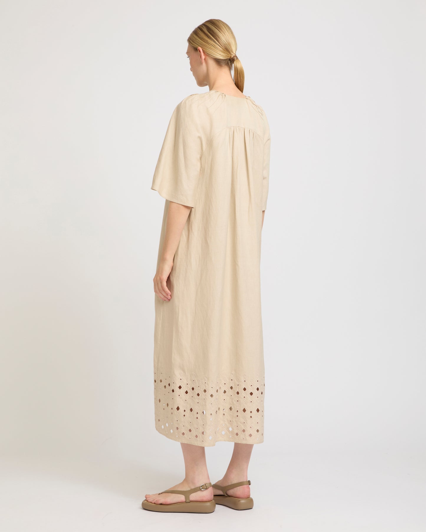 Flowing dress in embroidered linen