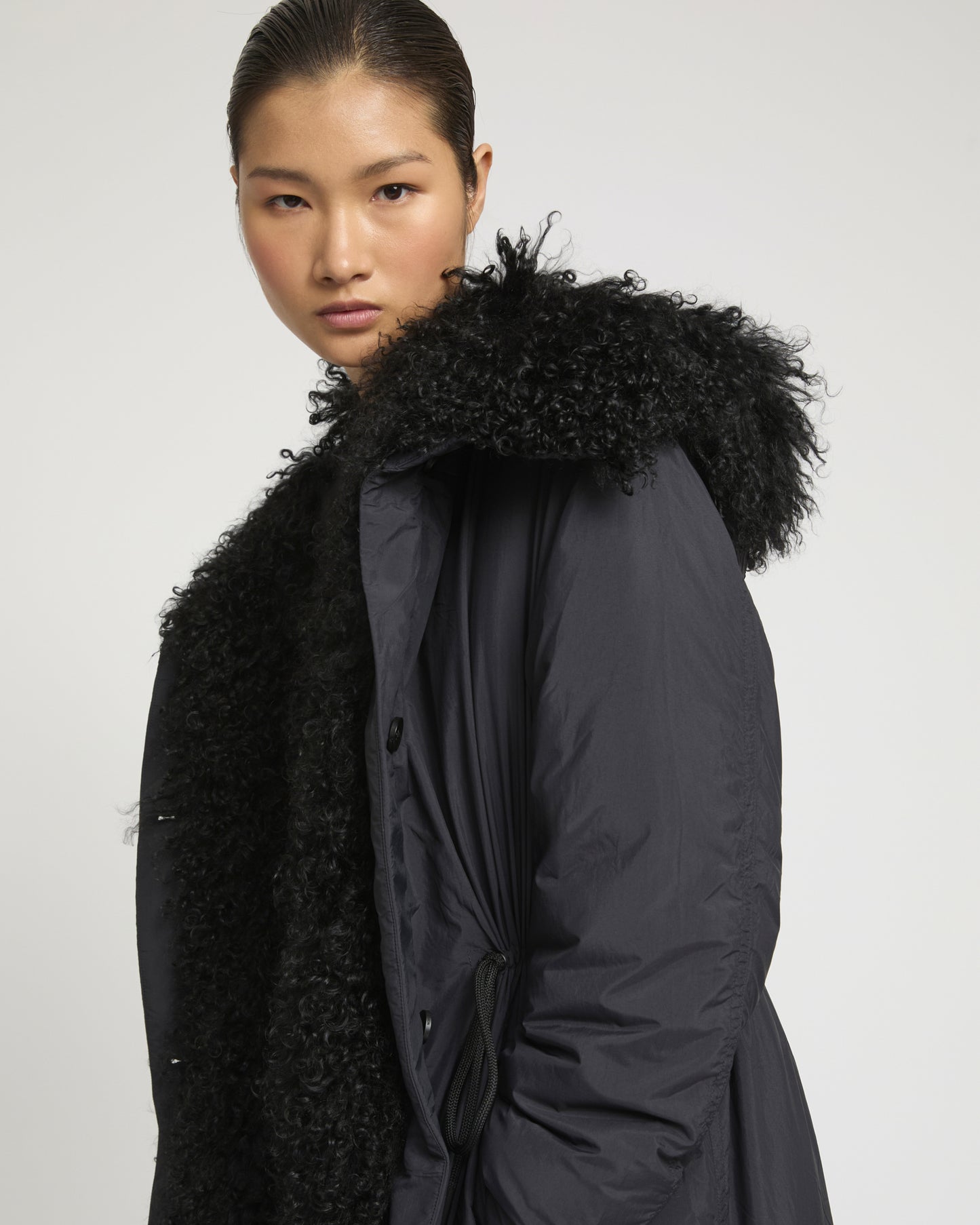 Ultra-light down parka with curly lambskin trim