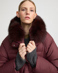 Long down jacket with raglan sleeves and fox fur trim