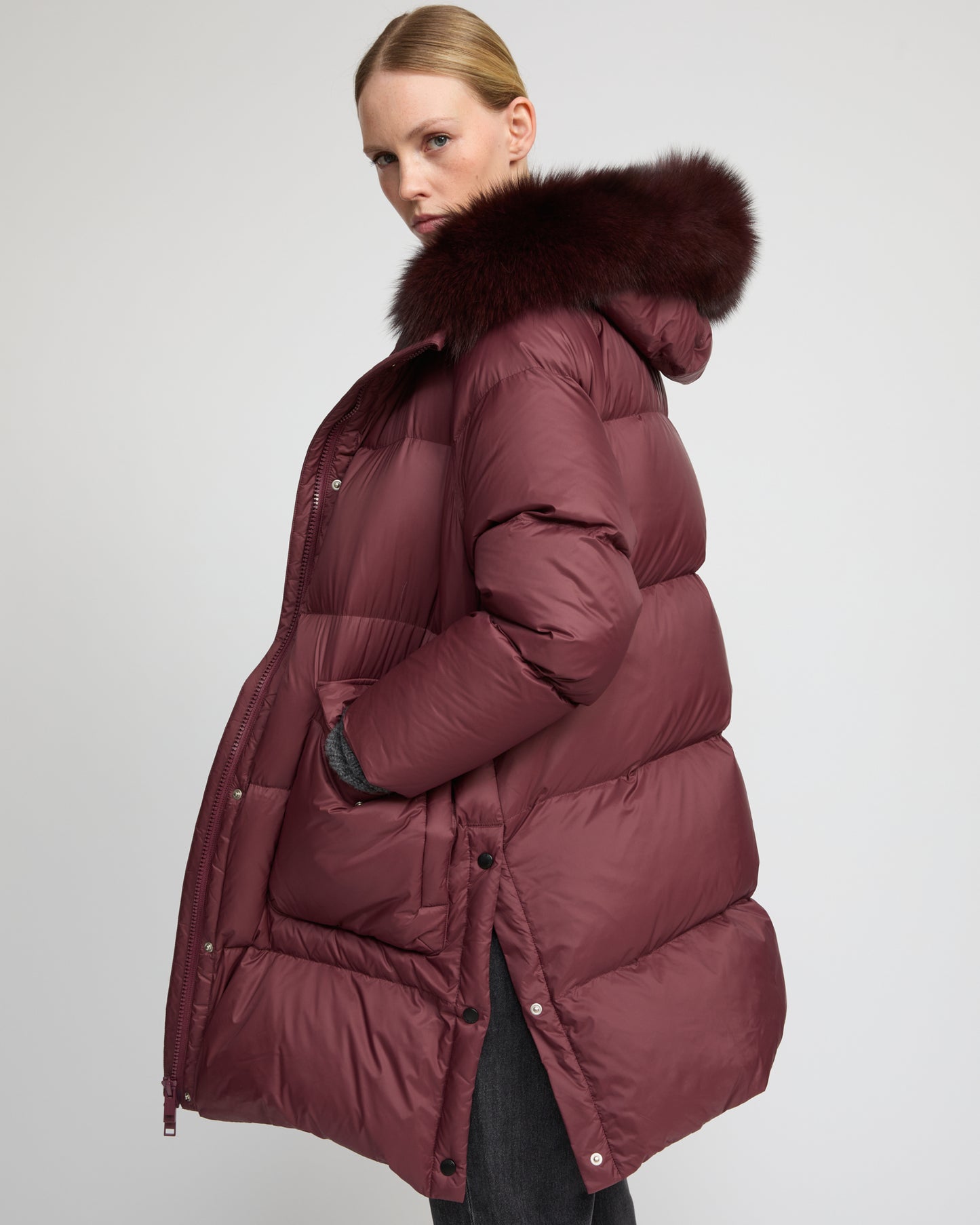 Long down jacket with raglan sleeves and fox fur trim