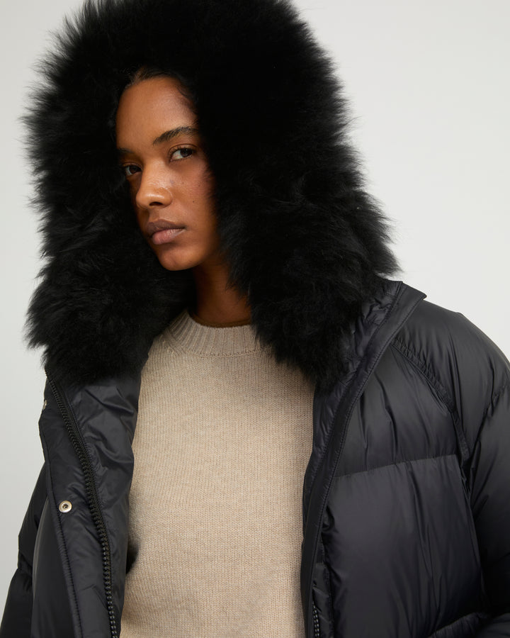 Long down jacket with raglan sleeves and fluffy lambswool trim