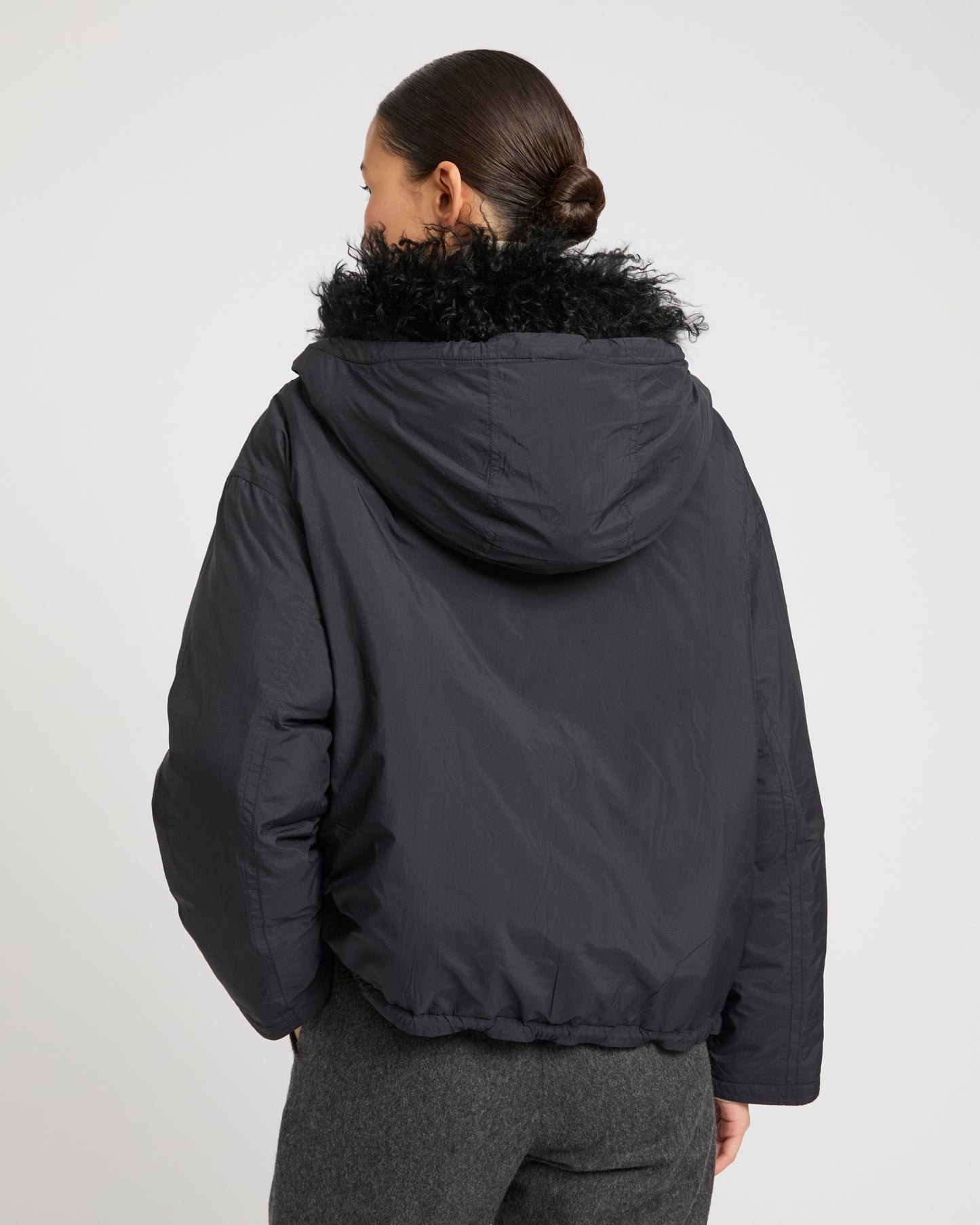 Short ultra-light down jacket with curly lambskin trim