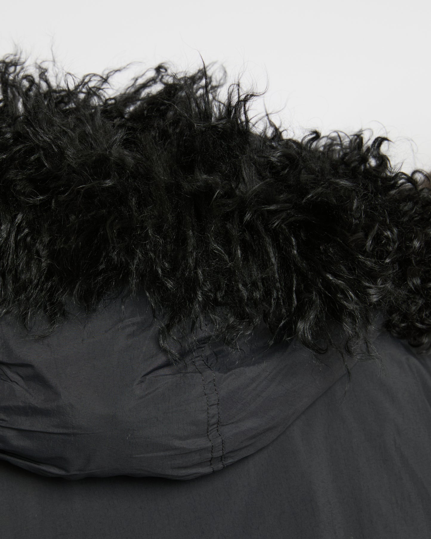 Short ultra-light down jacket with curly lambskin trim
