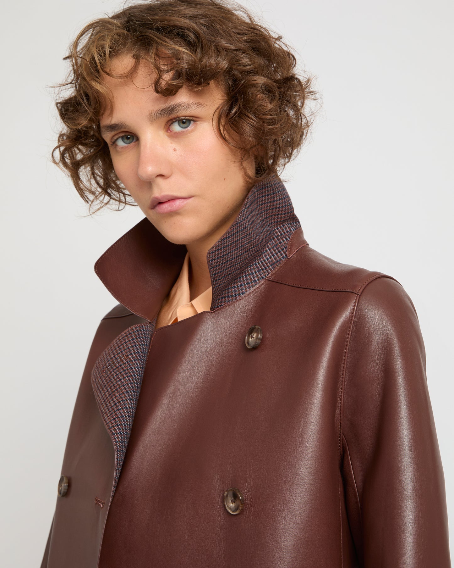 Double-breasted coat in bonded leather and wool