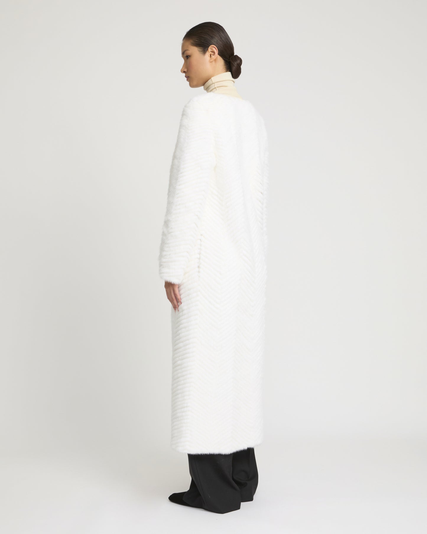 Long coat in Merino knit and mink fur