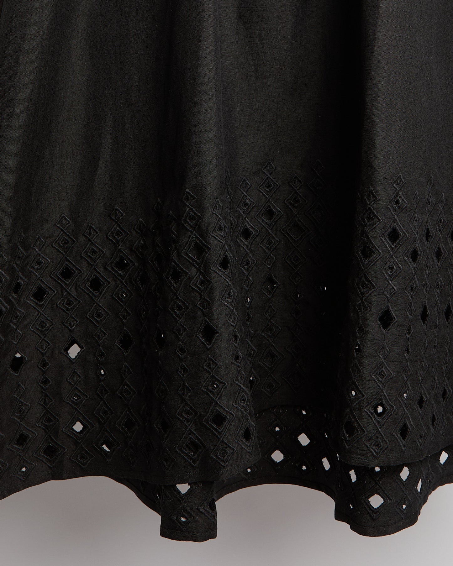 Flowing dress in embroidered linen