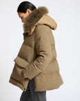 Hooded down jacket in 100% cashmere membrane fabric with long curly lambskin trim