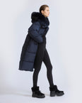 Long down jacket in waterproof technical fabric with fox fur trim