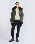 Down jacket in waterproof technical fabric with mittens and fox fur trim