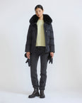 Down jacket in waterproof technical fabric with mittens and fox fur trim