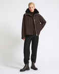 Short hooded parka in waterproof technical fabric with lambskin shearling