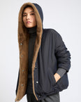 Short smooth hooded down jacket in water-repellent technical fabric with mink fur lining