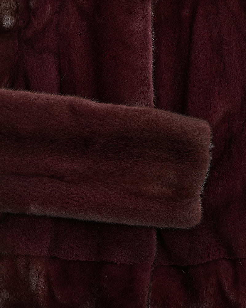 Collarless coat in long-haired mink