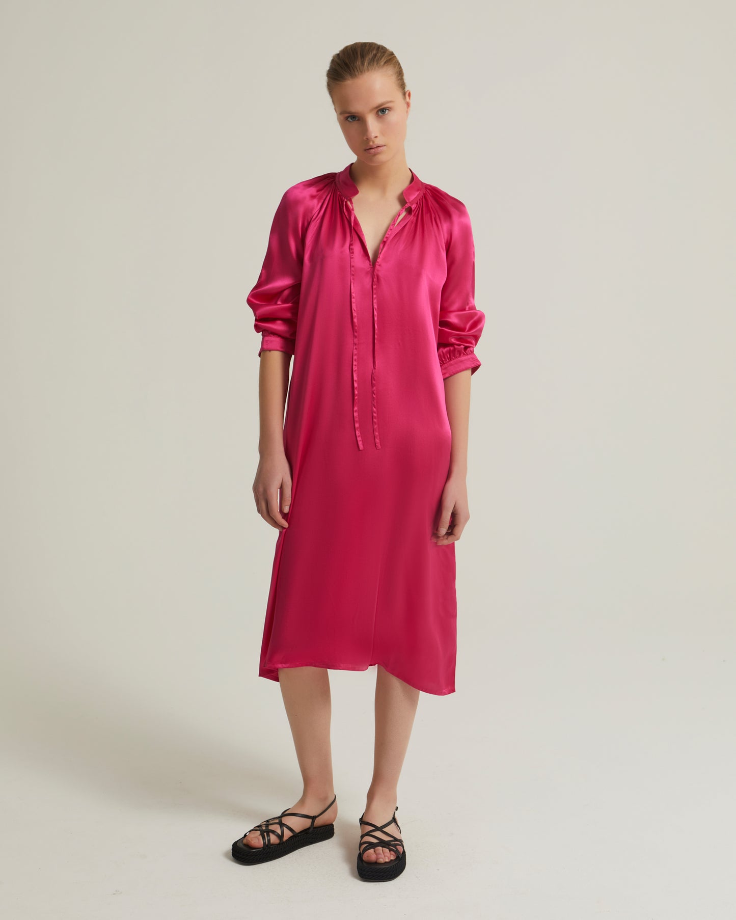 Flowing dress with long sleeves in silk satin