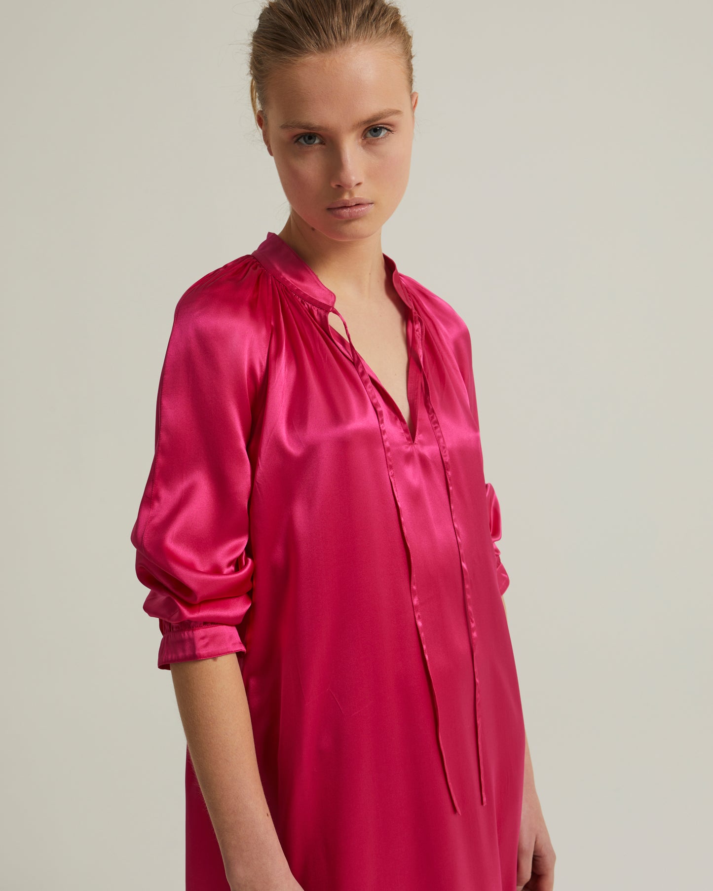 Flowing dress with long sleeves in silk satin