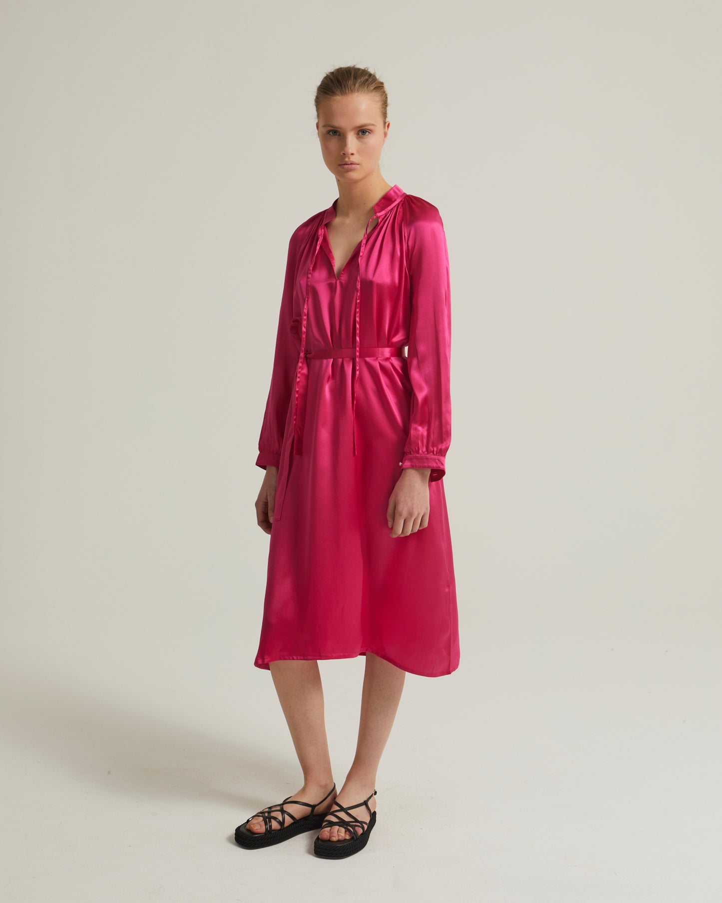 Flowing dress with long sleeves in silk satin
