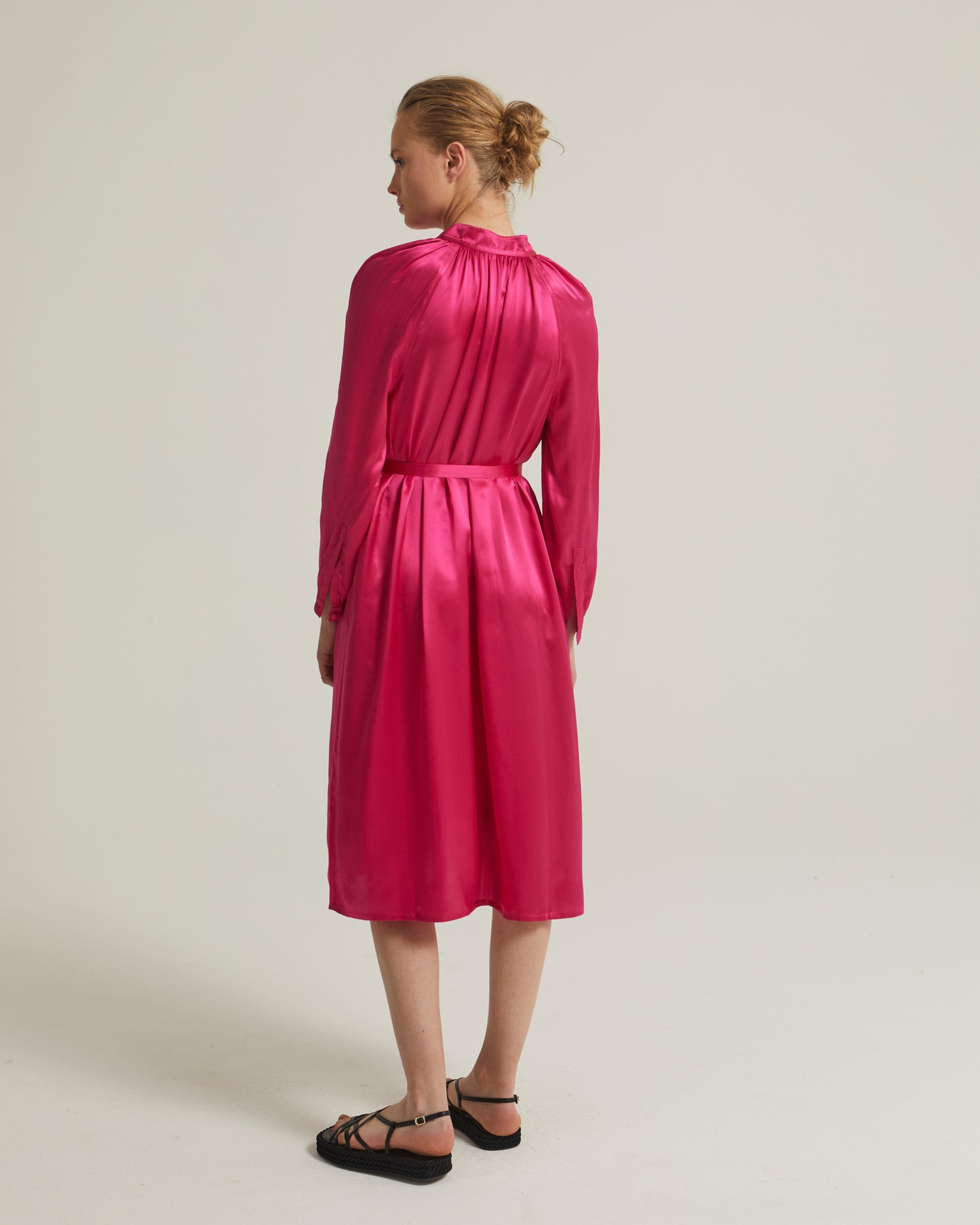 Flowing dress with long sleeves in silk satin