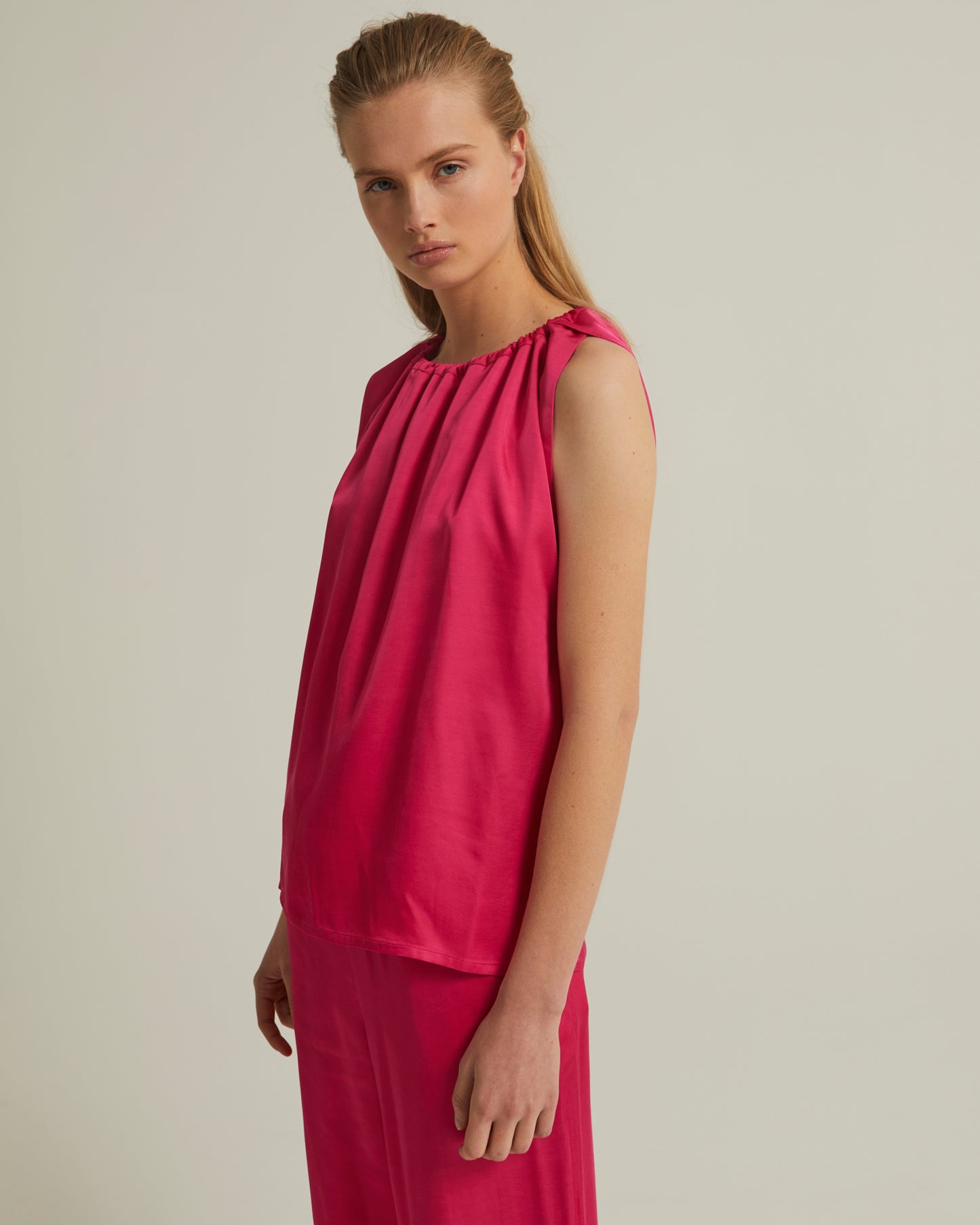 Sleeveless top with adjustable satin neckline